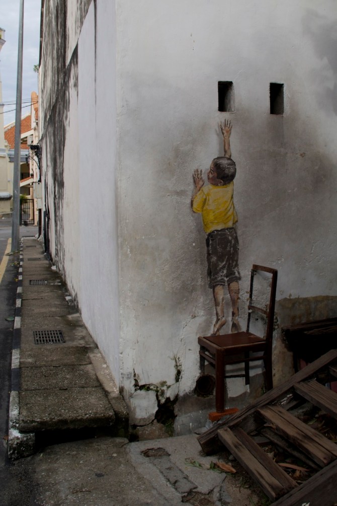 The chair is mostly real; the kid is entirely fake.